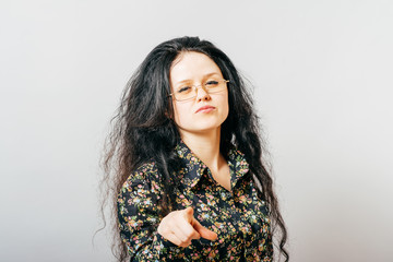long-haired woman points finger, teacher
