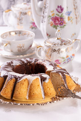 Fresh delicious cupcake covered with chocolate on the table