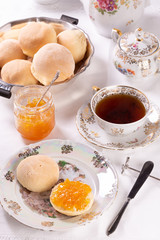 Fresh delicious small muffins with orange jam for morning tea