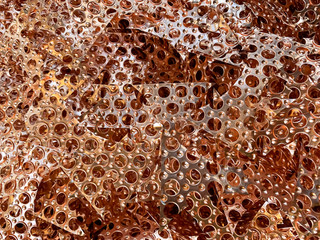 Copper honeycomb cuttings ready to be recycled, landscape view 