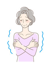 寒気を感じて震える女性