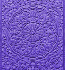 Violet ceramic tile with floral pattern for wall and floor decoration. Concrete stone surface background. Texture with mandala ornament  for interior design project.
