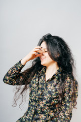 girl closes nose hand