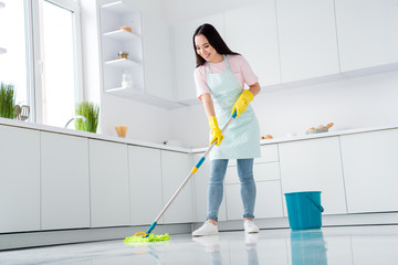 Full length body size view of her she nice attractive cheerful cheery careful girl washer wiping...