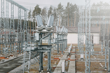  Poles and generator of the power station. A power station that supplies the city with electricity.