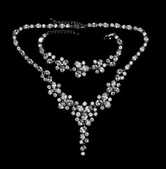 Necklace with precious stones diamonds on a black background