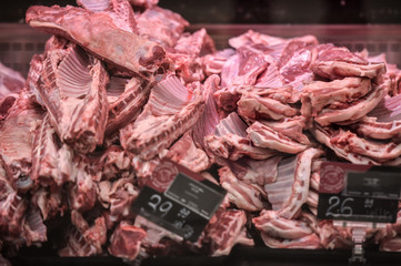 Lamb meat cuts are seen in a refrigerated case in a supermarket