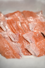Detail with fresh salmon fillet on ice in a supermarket