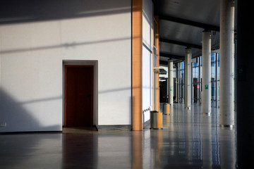 Airport interior, windows, stairs lights and shadows