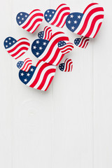 Flat lay of heart-shaped american flags with copy space