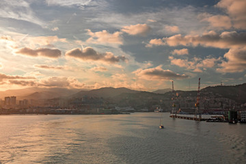 Naklejka premium Panoramic view of Genoa and its port seen from the sea.