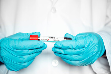 Nurse's hand taking a blood test of Covid-19