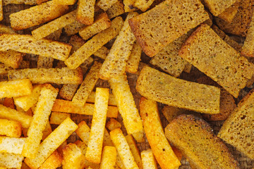 Salted rye and wheat bread crusts background