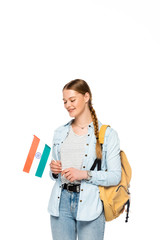 smiling pretty student with backpack holding flag of India isolated on white