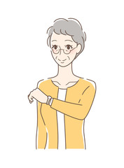 腕時計を見る女性