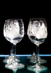 Crystal wine glasses on a black background