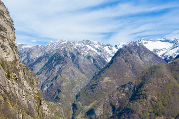 Fototapeta na wymiar aerial mountain panorama in Ticino Lavizzara with snowcapped mountains