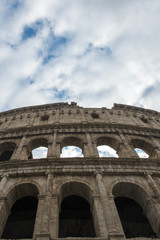 Colosseum in Rome, Italy. Ancient Roman Colosseum is one of the main tourist attractions in Europe. People visit the famous Colosseum in Roma center. Scenic view of Colosseum ruins.