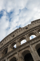 Colosseum in Rome, Italy. Ancient Roman Colosseum is one of the main tourist attractions in Europe. People visit the famous Colosseum in Roma center. Scenic view of Colosseum ruins.