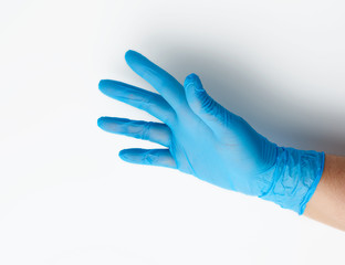 blue medical glove is worn on the arm, part of the body on a white background
