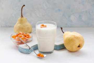 Smoothie with pears and frozen sea buckthorn berries