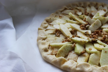 Raw Apple pie before putting it in the oven. Homemade cake. Housework.