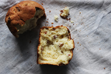 A broken raisin cake on the table. Homemade cake. Concept of homework during the quarantine period.