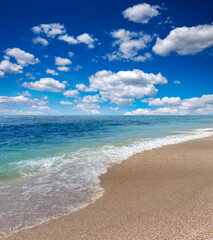 Seashore with blue sky and white clouds.on a sunny day.