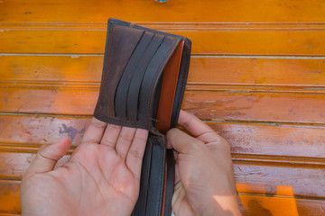 Male hand hold with an empty wallet