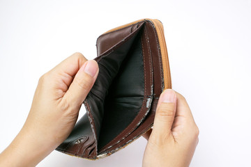 Hand open an old empty wallet or purse on white background, No Money                                                