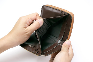 Lack of financial liquidity, Hand open an old empty wallet or purse on white background, , poor status                               