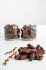 Dates fruit on white background. Medjool dried date palm fruits