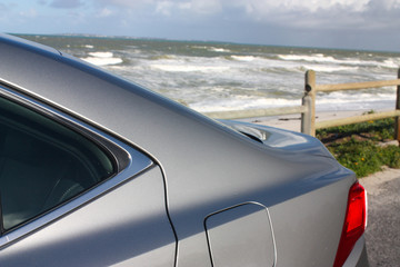 Fototapeta na wymiar Luxury car near the beach