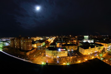 view from the roof of the city under the moon
