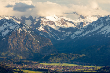 Amazing view Snow-covered Mountains with village in valley. Sunset or Sunrise in Oberstdorf, Germany.