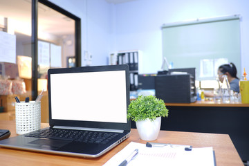 Cropped shot view of  white office desk table with the office equipments, alcohol sanitizer, face mask and other office supplies on the modern space, flat lay.work at home.
