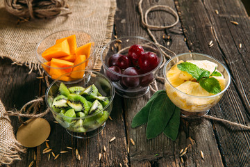 Fototapeta na wymiar Healhy organic vitamins food chopped fruits 
