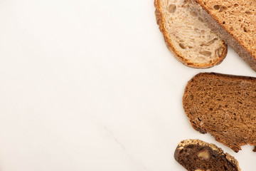 top view of fresh whole grain bread slices on white background