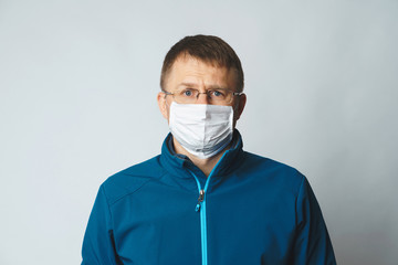 sad man in medical mask