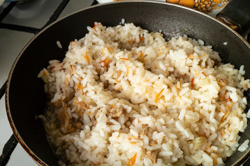 Rice with meat and vegetable fried on pan