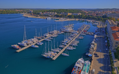 PULA, CROATIA - SEPTEMBER 13, 2019: Aerial shoot of Pula harbor and marina with boats and sailboats, Adriatic tourist destination Pula, Croatia.