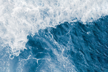 Dark blue sea wave and white foam