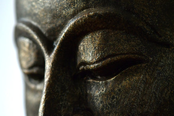 A close up face of the buddha