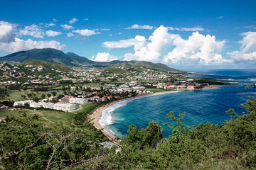 St.Kitts Island/Saint Kitts and Nevis - Nov 29, 2016: Beautiful view from the green mountain showing Caribbean sea and the beach. Breathtaking travel picture.