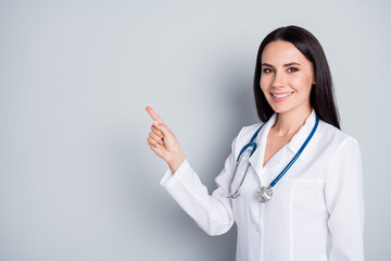 Disinfect your hands. Photo of beautiful family doc lady assistant virology clinic direct finger empty space show banner rules safety wear lab coat stethoscope isolated grey color background