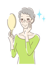 笑顔で手鏡を見る女性