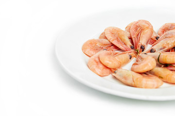 boiled shrimp in a plate on a white background