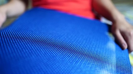 Crop woman touching material of chair back