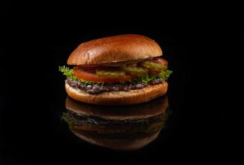fresh tasty burger isolated on black background