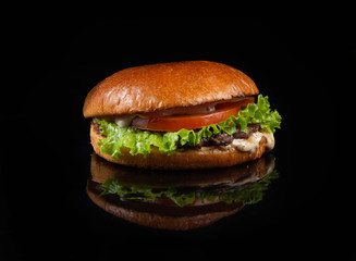 fresh tasty burger isolated on black background
